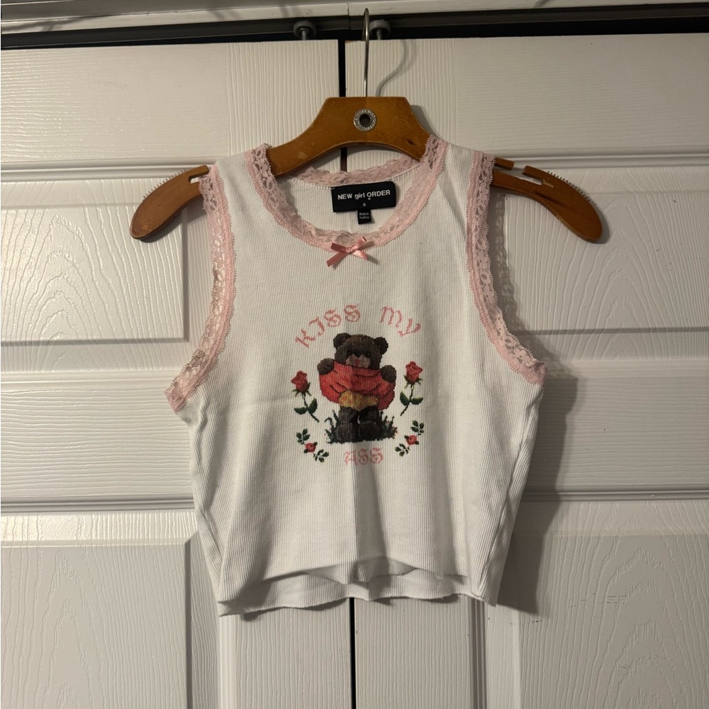 White and pink graphic tank top. Size 8 (fits small)